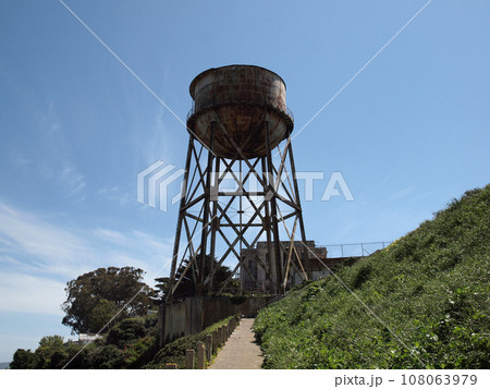 Path to Rusted out Water Tower with prison behind it 108063979