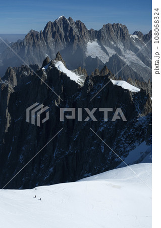 Two Mountaineers on Snow in the Mountains in French Alps. 108068324