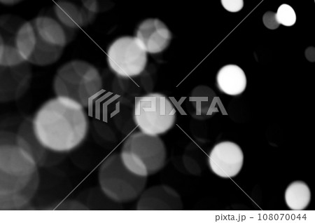 Abstract Dark Background with Defocused White Lights. 108070044