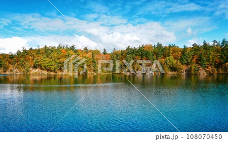 Pink Lake, Gatineau, Quebec, Canada during fall season with colorful tree 108070450
