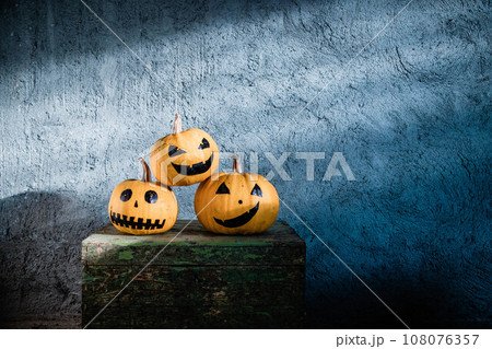 scary funny Halloween pumpkins on wooden table 108076357