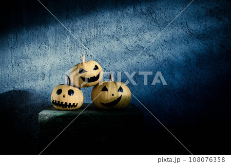 scary funny Halloween pumpkins on wooden table 108076358