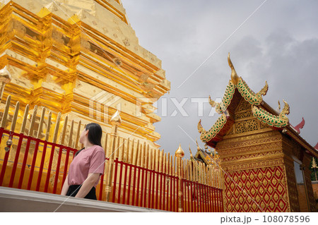 asian woman travel and see to gold temple at chiangmai  Thailand in summer season 108078596