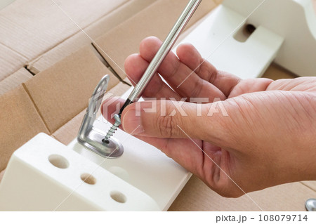 Assembly furniture using screwdriver at home Assembly furniture using screwdriver at home 108079714