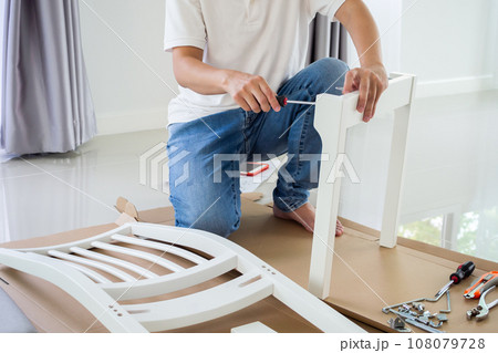 Assembly furniture using screwdriver at home Assembly furniture using screwdriver at home 108079728