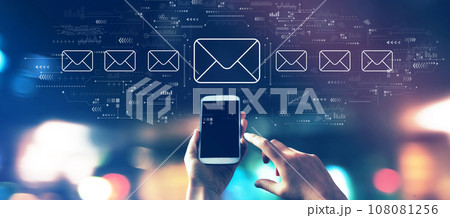 Email concept with a smartphone in city lights at night 108081256