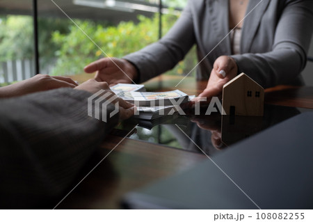 Real estate agent presenting and approved home loan contract. Real estate investment, Home mortgage concept. Real estate agent presenting and approved home loan contract. Real estate investment, Home mortgage concept. 108082255