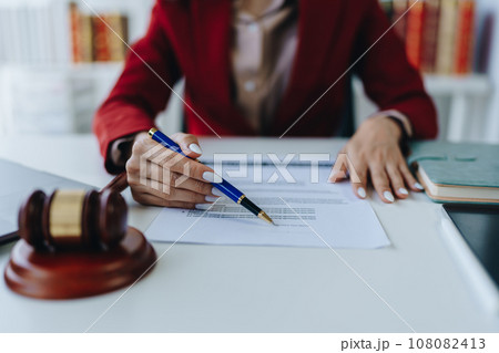 The lawyer with a client discussing contract paper, a Business lawyer working about legal legislation in the courtroom to help their customer, contract and agreement concept The lawyer with a client discussing contract paper, a Business lawyer working about legal legislation in the courtroom to help their customer, contract and agreement concept 108082413