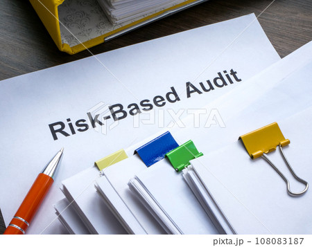 Risk based audit report and a pen. 108083187