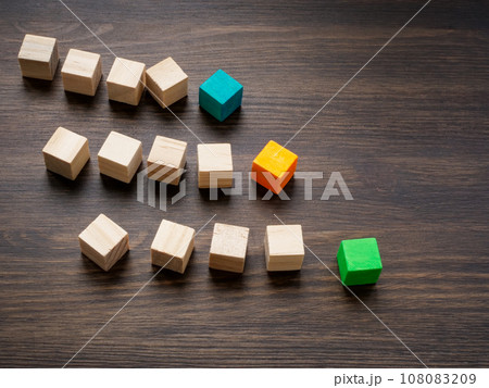 Columns of cubes as symbol of competition between teams and companies. Leadership and competition. 108083209