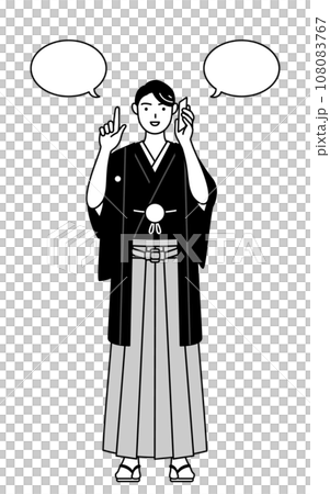 A man wearing a crested hakama pointing while talking on the phone A man wearing a crested hakama pointing while talking on the phone 108083767