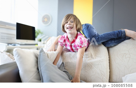 Girl and boy play around on couch at home and laugh. Girl and boy play around on couch at home and laugh. 108085508
