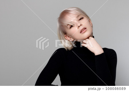 portrait of Beautiful blonde woman in back dress 108086089