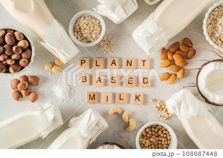 Plant based milk concept - selection of alternative milks on rustic background Plant based milk concept - selection of alternative milks on rustic background 108087448
