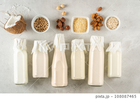 Plant based milk concept - selection of alternative milks on rustic background Plant based milk concept - selection of alternative milks on rustic background 108087465