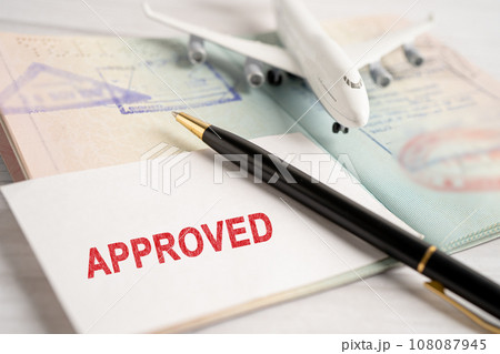 Approved Stamp visa and passport document to immigration at airport in country. 108087945