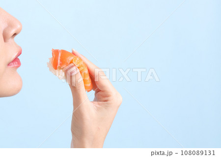 Hand with Sushi 108089131