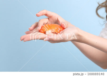 Hand with Sushi 108089140