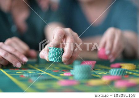 hand of the player making the bet in a casino hand of the player making the bet in a casino 108091159