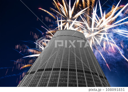 Celebratory fireworks over the Skyscrapers La Defense, commercial and business center of Paris, France 108091831