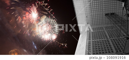 Celebratory fireworks over the La Grande Arche. La Defense, commercial and business center of Paris, France Celebratory fireworks over the La Grande Arche. La Defense, commercial and business center of Paris, France 108091916