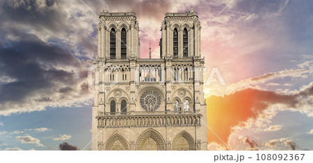 Notre Dame de Paris (against the background of a sky at sunset), also known as Notre Dame Cathedral or simply Notre Dame, is a Gothic, Roman Catholic cathedral of Paris, France 108092367