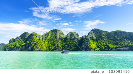 Landscape of amazing green lush tropical islands and turquoise sea near Phuket, Thailand. Landscape of amazing green lush tropical islands and turquoise sea near Phuket, Thailand. 108093410