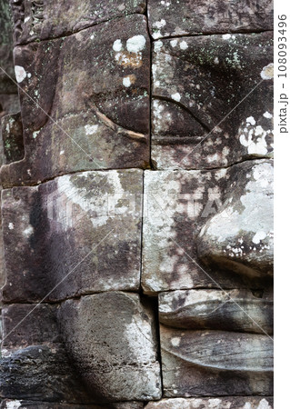 The stone face of the khmer king on the wall of Bayon Temple, Angkor Thom, Siem Reap, Cambodia. 108093496
