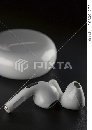 ROSTOV-ON-DON, RUSSIA - APRIL 28, 2018: Apple AirPods wireless Bluetooth headphones and charging case for Apple iPhone. New Apple Earpods Airpods in box. 108094275