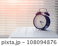 Close up alarm clock at the window area 108094876