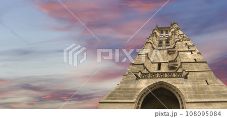Saint-Jacques Tower (Tour Saint-Jacques) against the background of a beautiful sky at sunset. Located on Rivoli street, Paris, France. This 52 m Flamboyant Gothic tower (XVI century) 108095084