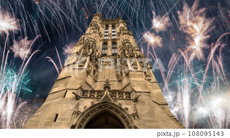 Celebratory colorful fireworks over the Saint-Jacques Tower (Tour Saint-Jacques). Located on Rivoli street, Paris, France. This 52 m Flamboyant Gothic tower (XVI century) 108095143