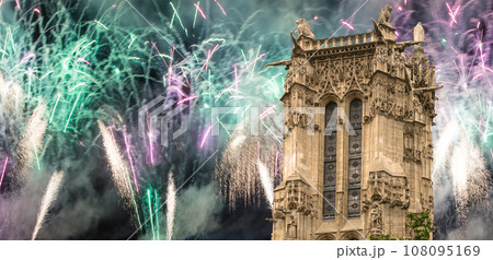 Celebratory colorful fireworks over the Saint-Jacques Tower (Tour Saint-Jacques). Located on Rivoli street, Paris, France. This 52 m Flamboyant Gothic tower (XVI century) 108095169
