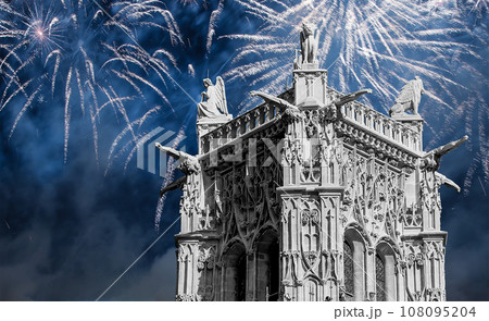 Celebratory colorful fireworks over the Saint-Jacques Tower (Tour Saint-Jacques). Located on Rivoli street, Paris, France. This 52 m Flamboyant Gothic tower (XVI century) 108095204