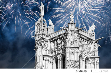 Celebratory colorful fireworks over the Saint-Jacques Tower (Tour Saint-Jacques). Located on Rivoli street, Paris, France. This 52 m Flamboyant Gothic tower (XVI century) 108095208