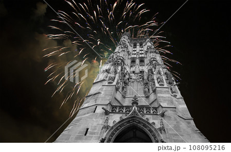Celebratory colorful fireworks over the Saint-Jacques Tower (Tour Saint-Jacques). Located on Rivoli street, Paris, France. This 52 m Flamboyant Gothic tower (XVI century) 108095216