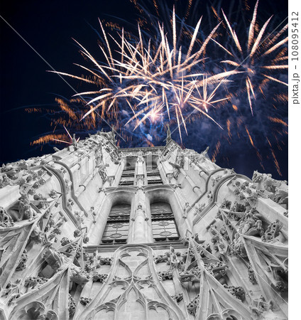 Celebratory colorful fireworks over the Saint-Jacques Tower (Tour Saint-Jacques). Located on Rivoli street, Paris, France. This 52 m Flamboyant Gothic tower (XVI century) 108095412