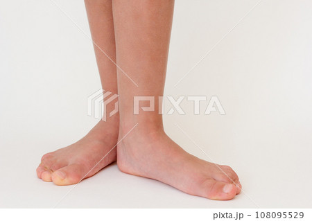 Cropped barefoot child legs Cropped barefoot child legs 108095529