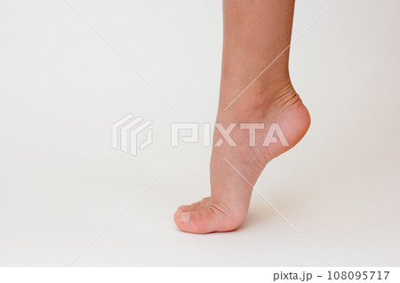 Cropped child leg with lifted heel Cropped child leg with lifted heel 108095717