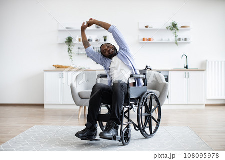 Person with disability working out at home 108095978