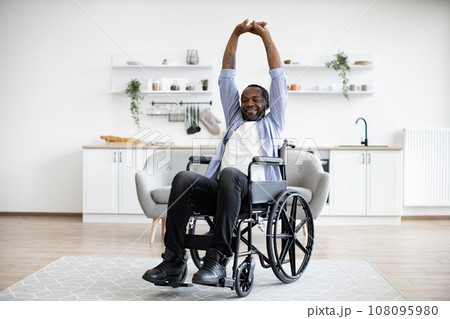 Person with disability working out at home 108095980