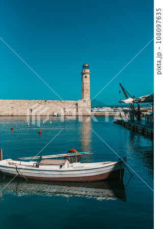 Featuring the old lighthouse and a boat, captured on a warm winter day. Featuring the old lighthouse and a boat, captured on a warm winter day. 108097635