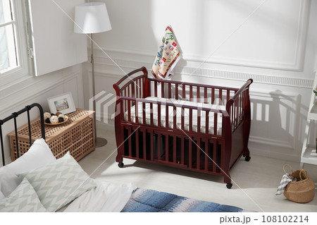 cozy bedroom with baby bed and lamp cozy bedroom with baby bed and lamp 108102214