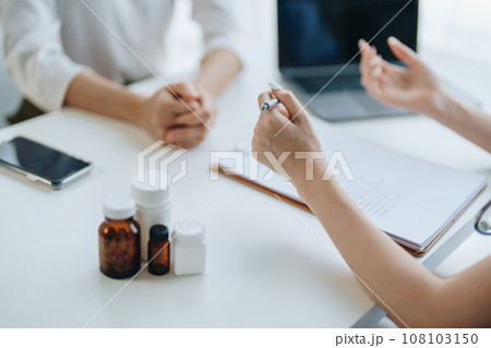 A doctor psychologist is giving counseling to a depressed patient. A doctor psychologist is giving counseling to a depressed patient. 108103150