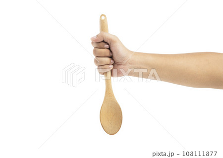 Human hand holding wooden spoon Human hand holding wooden spoon 108111877