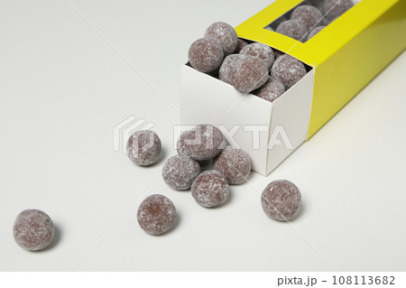 Chocolate candies in box on white background, close up Chocolate candies in box on white background, close up 108113682