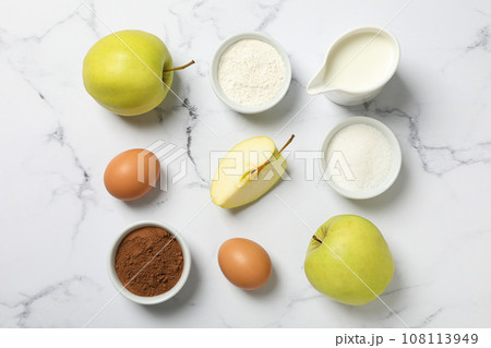 The ingredients are laid out on the table for preparing autumn pastries. 108113949