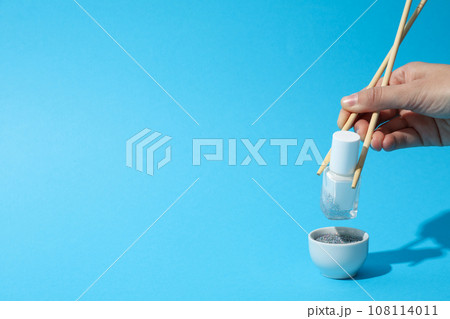 White nail polish with chopsticks for sushi and a bowl 108114011