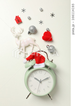 A clock with a Santa hat with a New Year's decoration. 108114193