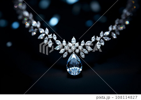Luxury jewelry, platinum necklace with diamonds on dark silk fabric close-up. Golden necklace in the store. Beautiful diamond pendant necklace. Jewelry showcase, selective focus 108114827